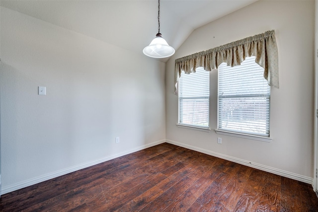 unfurnished room with baseboards, dark wood-style flooring, and vaulted ceiling