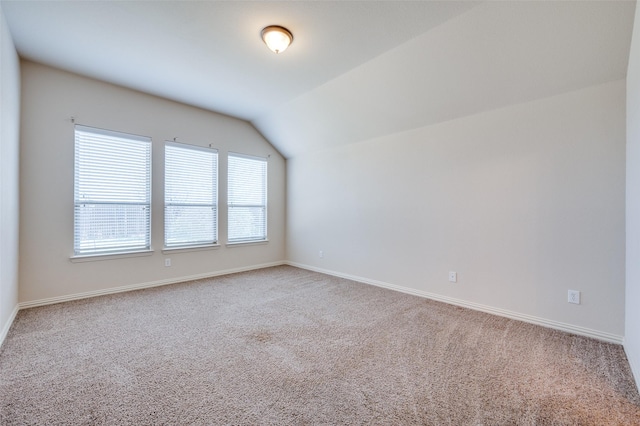 interior space with baseboards and vaulted ceiling