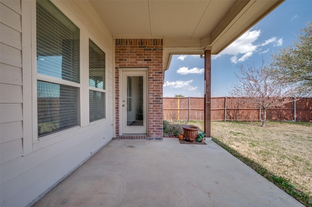 view of patio / terrace featuring fence