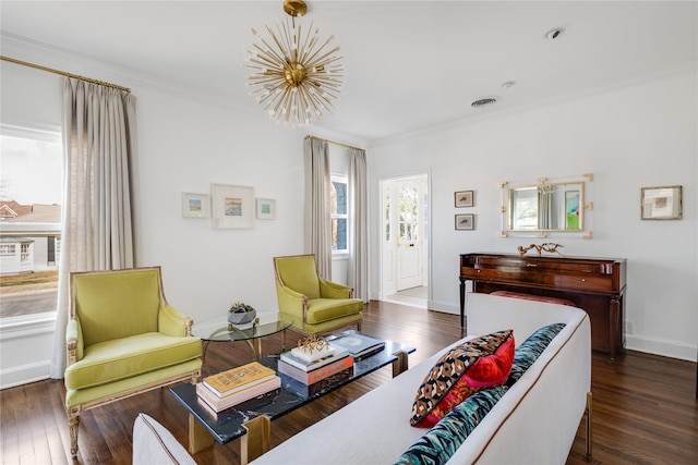 living room featuring a notable chandelier, crown molding, and dark hardwood / wood-style floors