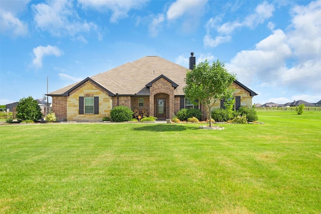 single story home with a front yard