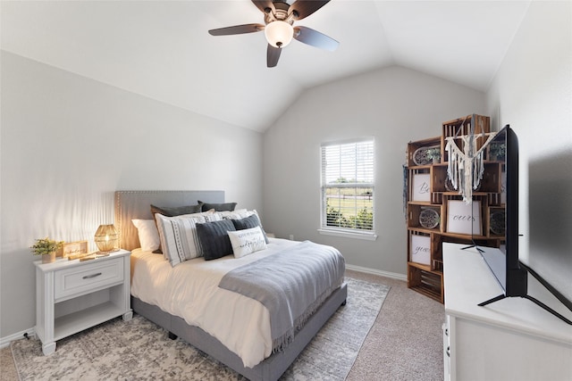 carpeted bedroom with vaulted ceiling and ceiling fan