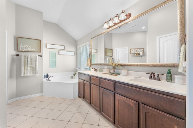 bathroom featuring lofted ceiling, tile patterned flooring, a bathtub, and vanity