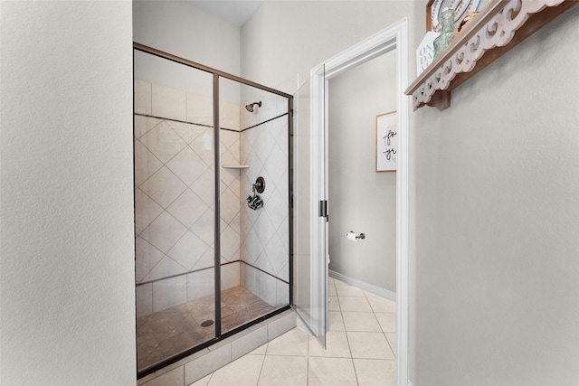 bathroom featuring tile patterned flooring and walk in shower