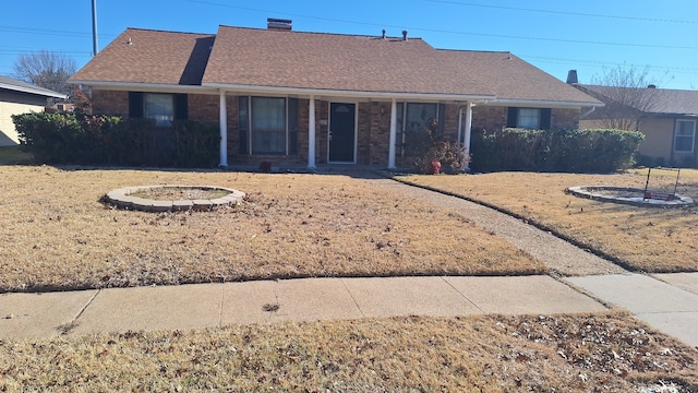 back of property featuring a yard and a porch