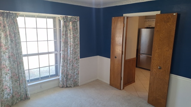 carpeted empty room with ornamental molding