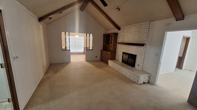 unfurnished living room featuring light carpet, a brick fireplace, beam ceiling, and high vaulted ceiling