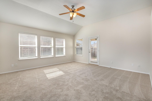 carpeted empty room with lofted ceiling and ceiling fan