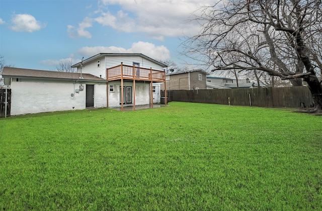 view of yard with a deck and a patio area