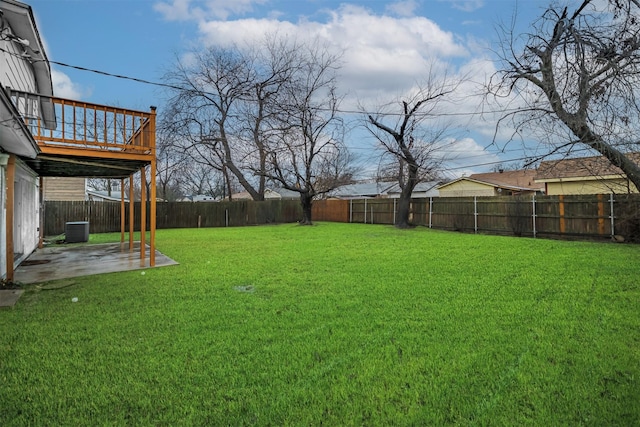 view of yard featuring a patio and central AC