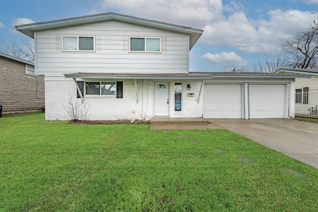 view of property featuring a garage and a front lawn