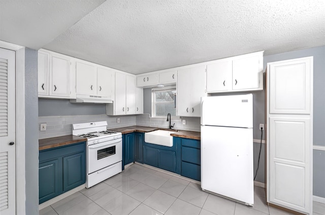 kitchen featuring white cabinetry, sink, white appliances, and wooden counters