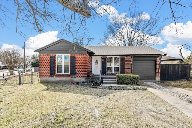 view of front of home with a garage and a front lawn