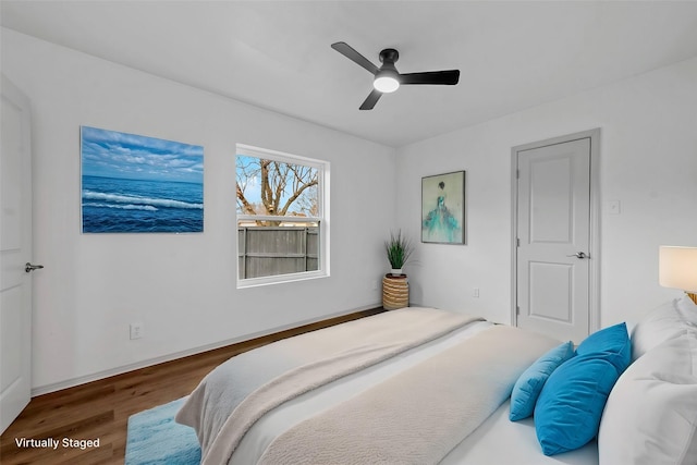 bedroom featuring dark hardwood / wood-style flooring and ceiling fan