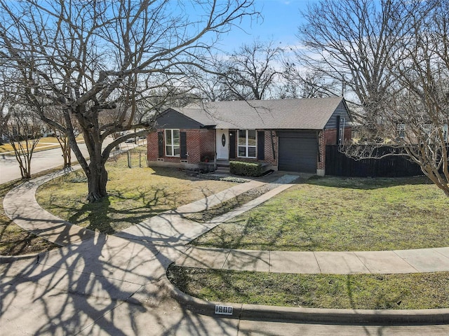 ranch-style home featuring a garage and a front lawn