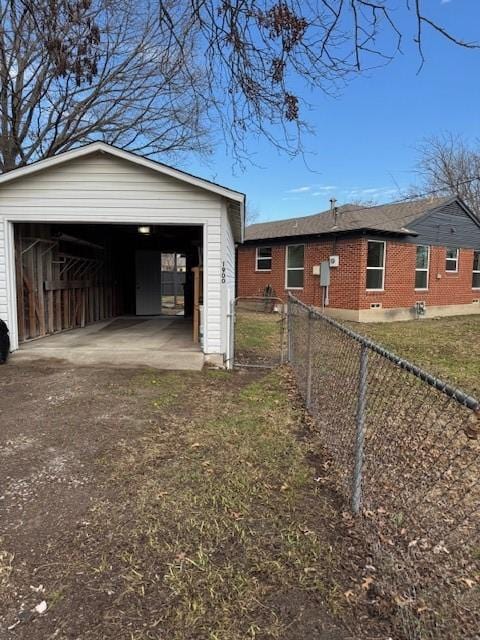 view of property exterior with an outbuilding and a garage