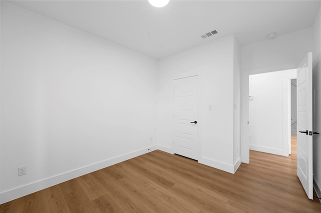 empty room featuring hardwood / wood-style flooring