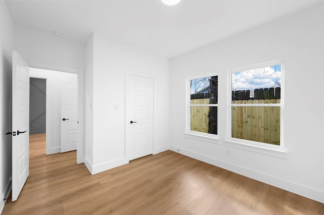 unfurnished bedroom featuring hardwood / wood-style flooring