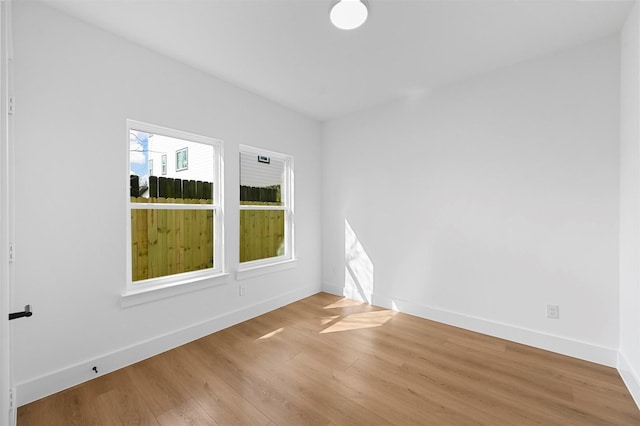 empty room with light wood-type flooring