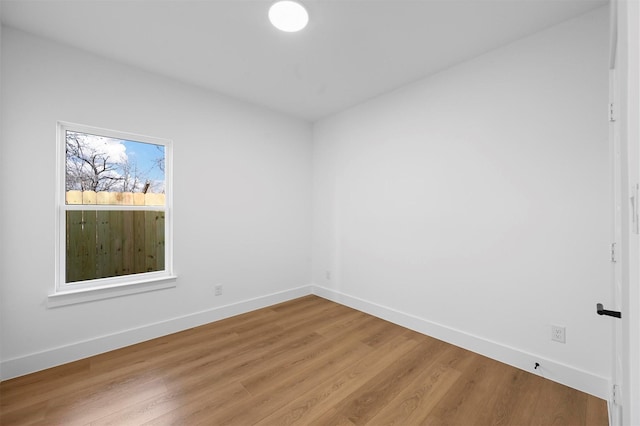 unfurnished room with light wood-type flooring