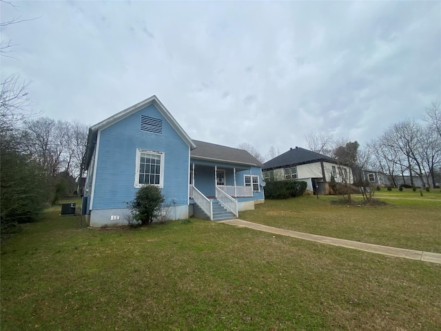 view of front of house with a front yard and a porch