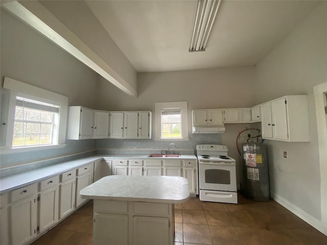 kitchen with electric stove, sink, white cabinetry, electric water heater, and a kitchen island