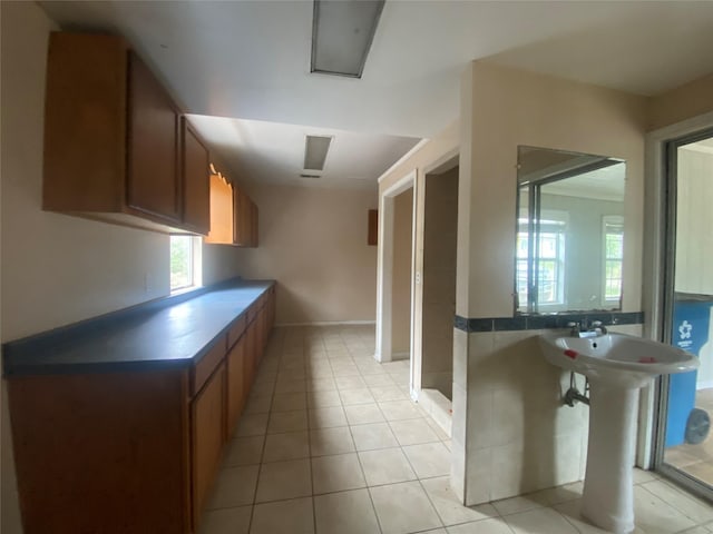 kitchen with light tile patterned floors