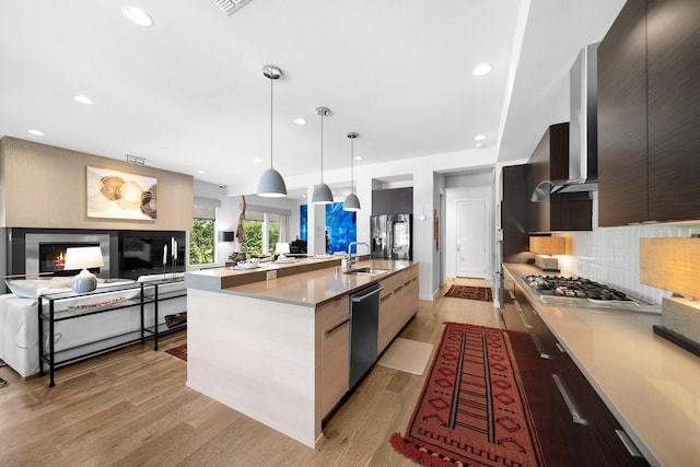 5399 Randwick Trl, Frisco, TX 75036 - kitchen featuring modern cabinets, appliances with stainless steel finishes, open floor plan, decorative backsplash, and recessed lighting