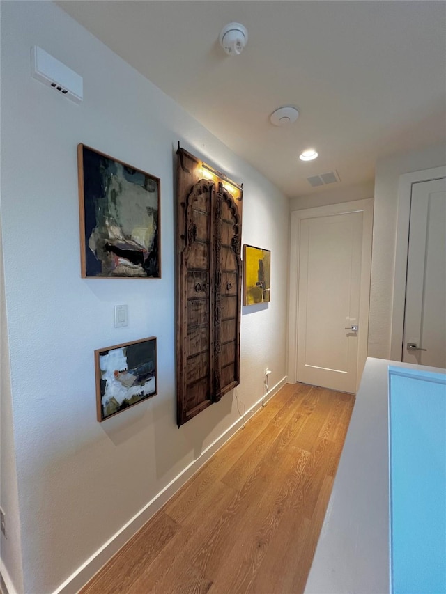 hallway with light wood-type flooring