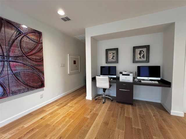 office space with light wood-type flooring