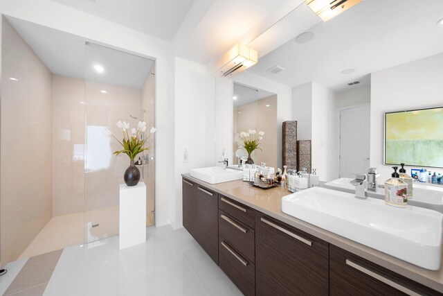 5399 Randwick Trl, Frisco, TX 75036 - bathroom with double vanity, a walk in shower, tile patterned floors, a wall mounted air conditioner, and recessed lighting