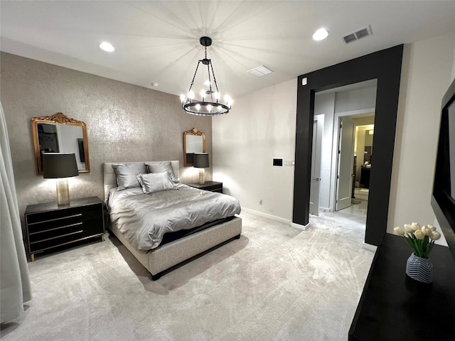 carpeted bedroom with an inviting chandelier