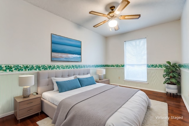 bedroom featuring dark hardwood / wood-style floors and ceiling fan