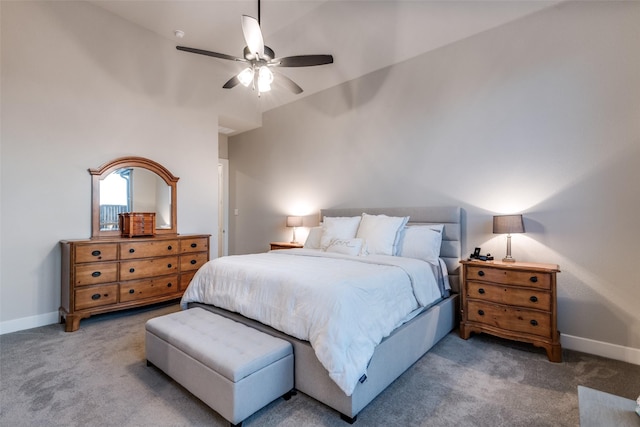 bedroom with a ceiling fan, baseboards, and carpet flooring