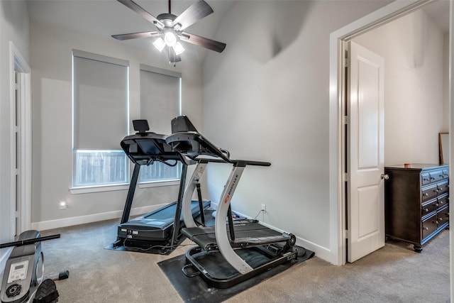 exercise room with light carpet and ceiling fan