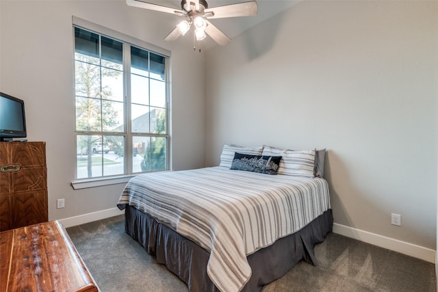 carpeted bedroom featuring ceiling fan and baseboards