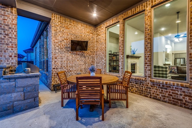 view of patio / terrace featuring exterior kitchen and outdoor dining space