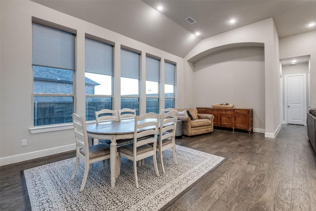 dining area featuring lofted ceiling, recessed lighting, dark wood-type flooring, visible vents, and baseboards