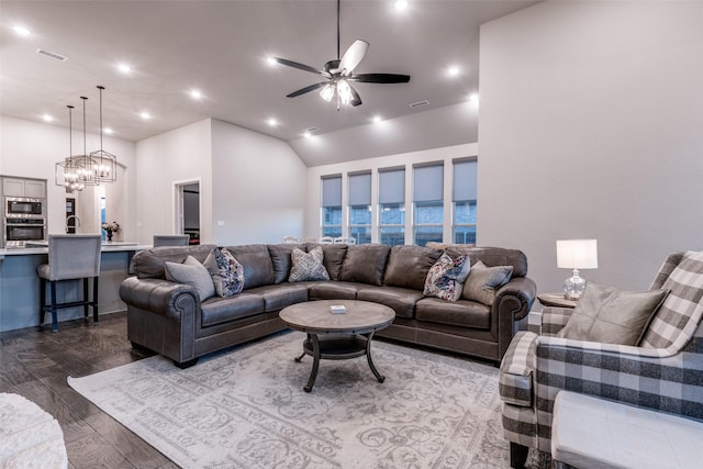 living area featuring ceiling fan with notable chandelier, wood finished floors, visible vents, and recessed lighting