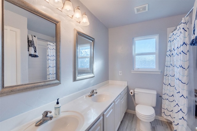 bathroom featuring vanity, hardwood / wood-style floors, toilet, and a shower with shower curtain