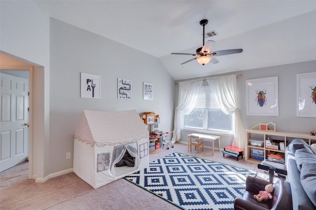 game room with ceiling fan, vaulted ceiling, and light carpet