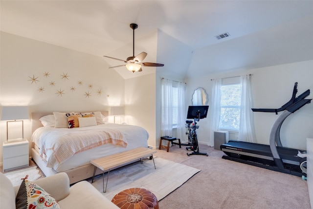 carpeted bedroom featuring lofted ceiling and ceiling fan