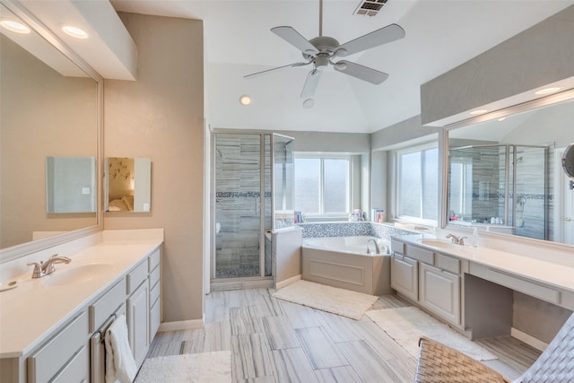 bathroom with vanity, lofted ceiling, independent shower and bath, and ceiling fan