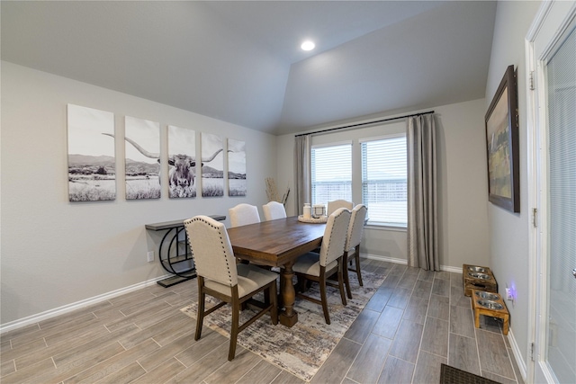 dining space with lofted ceiling