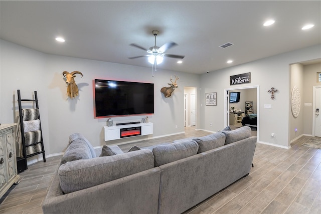 living room featuring ceiling fan