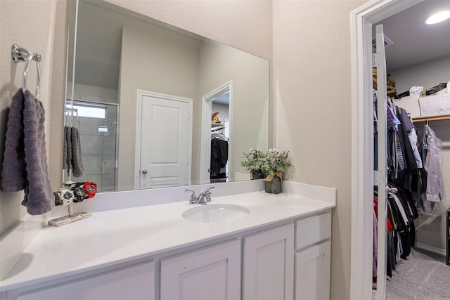 bathroom with vanity and an enclosed shower