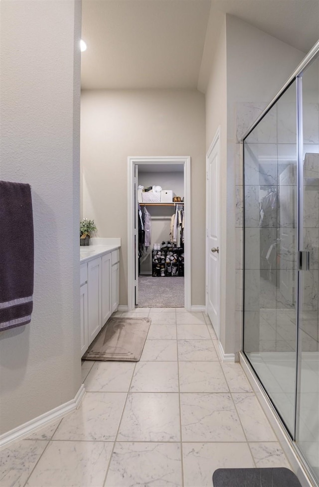 bathroom with vanity and an enclosed shower