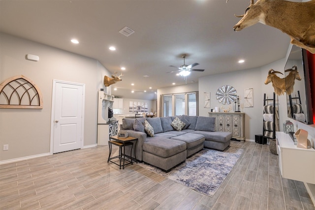 living room featuring ceiling fan