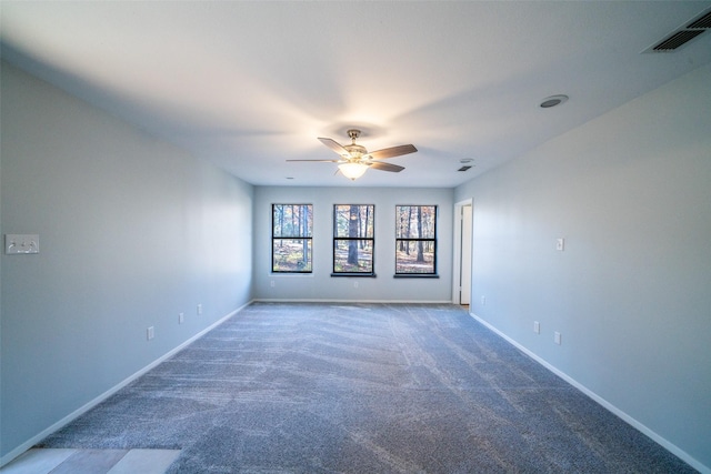 empty room featuring ceiling fan and carpet flooring