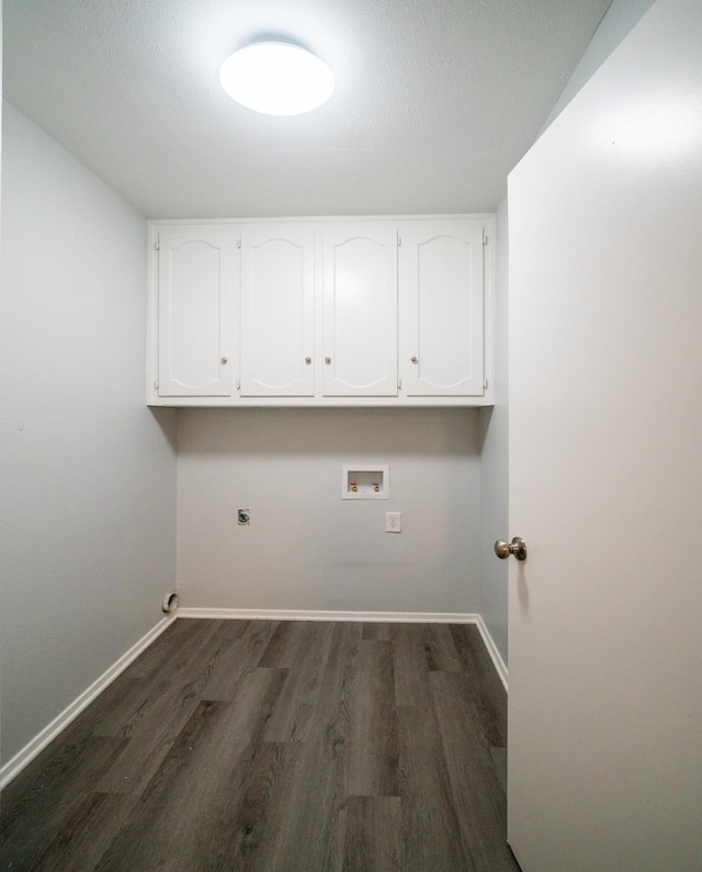 clothes washing area featuring cabinets, hookup for an electric dryer, dark hardwood / wood-style flooring, and hookup for a washing machine